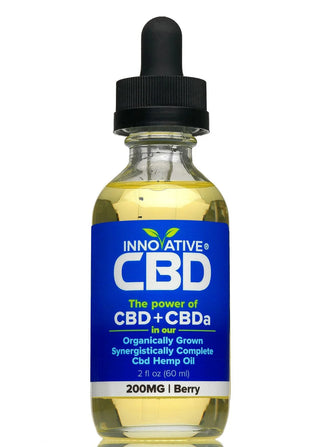 Bottle of Innovative CBD oil with a blue label on a white background