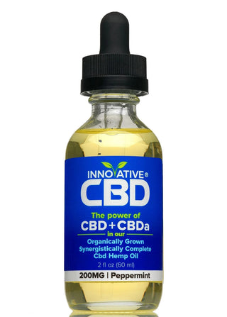 Bottle of Innovative CBD oil with a blue label on a white background