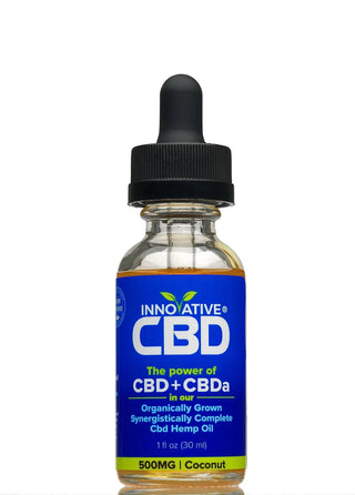 Bottle of Innovative CBD oil with a blue label on a white background