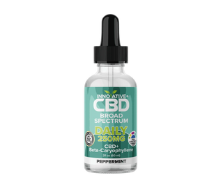 CBD oil bottle with dropper labeled 'Innovative CBD' on a white background