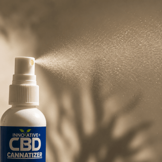 Close-up of Innovative CBD Cannatizer fine mist spray in luxury botanical skincare setting
