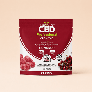 Clean isolated product image of Innovative CBD cherry CBD + THC trial size gumdrop pouch on a soft cream background with minimal luxury wellness styling.