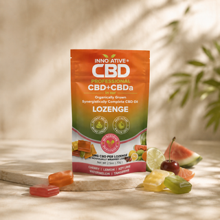 nnovative CBD full spectrum CBD lozenges pouch with colorful fruit flavored lozenges in a premium minimalist wellness setting.