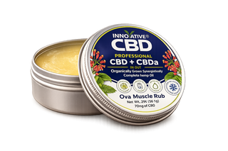 Transparent product shot of Innovative CBD Ova Muscle Rub open tin showing full spectrum CBD plus CBDa topical balm with cooling botanical ingredients.