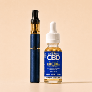 Innovative CBD Pumpkin Spice Latte full spectrum vape juice with premium vape pen on a soft cream background in a clean luxury wellness product display.