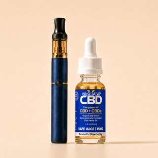 Innovative CBD Smooth Blueberry full spectrum vape juice with premium vape pen on a soft cream background in a clean luxury wellness product display.