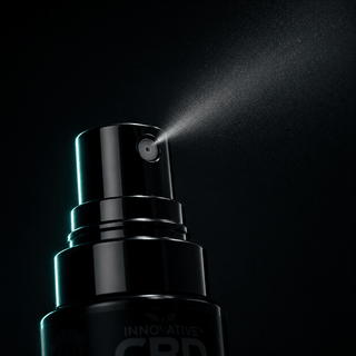 Editorial macro close-up of premium THC and CBD oral mist spray nozzle with ultra-fine atomized mist